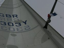 Courtesy flag from starboard spreader.