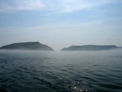 Approach to Skomer - the fog is lifting.