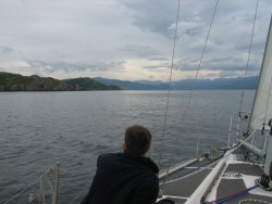 Phil gazing southward into Loch Eriboll, clouds indicate a blow on the way.
